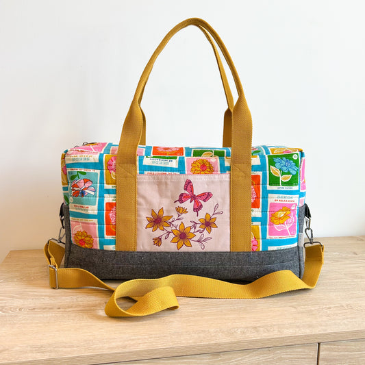 Skinny Travel Duffle in Blue Flowerland Seed Packets
